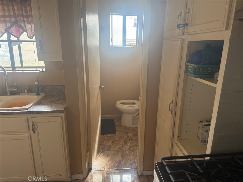 8634 Park, Unit 3 Bellflower, CA 90706 - Photo 6 of 12 a bathroom with a sink and a toilet