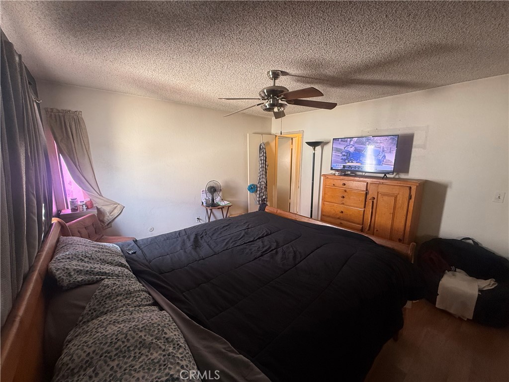 8634 Park, Unit 3 Bellflower, CA 90706 - Photo 10 of 12 a living room with furniture and a chandelier