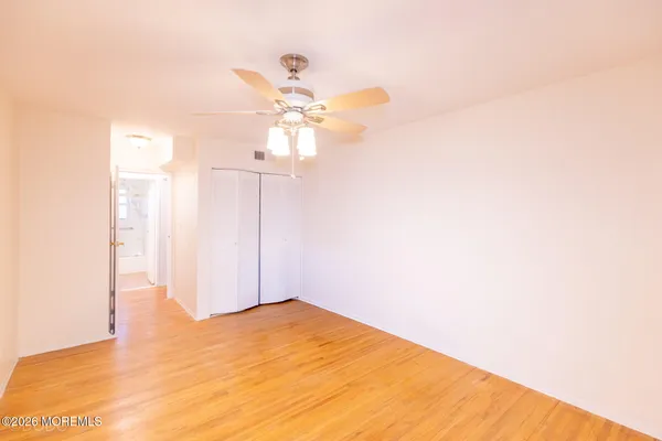 a view of a big room with carpet