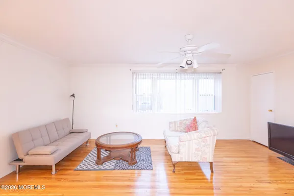 a living room with furniture and a table