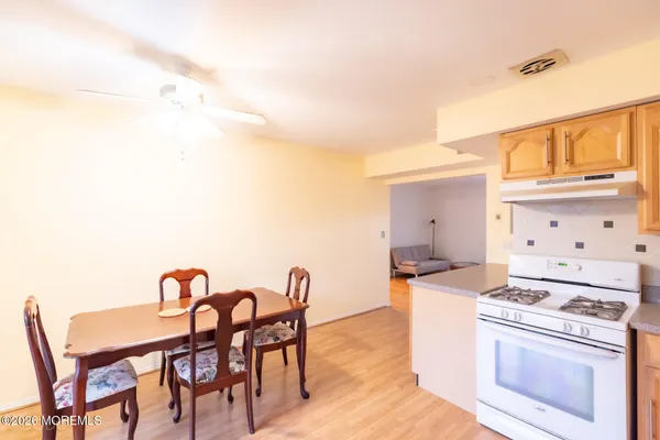 a dinning table and chairs in a kitchen
