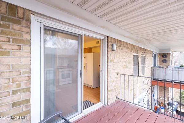 a view of a porch with wooden floor and outdoor space