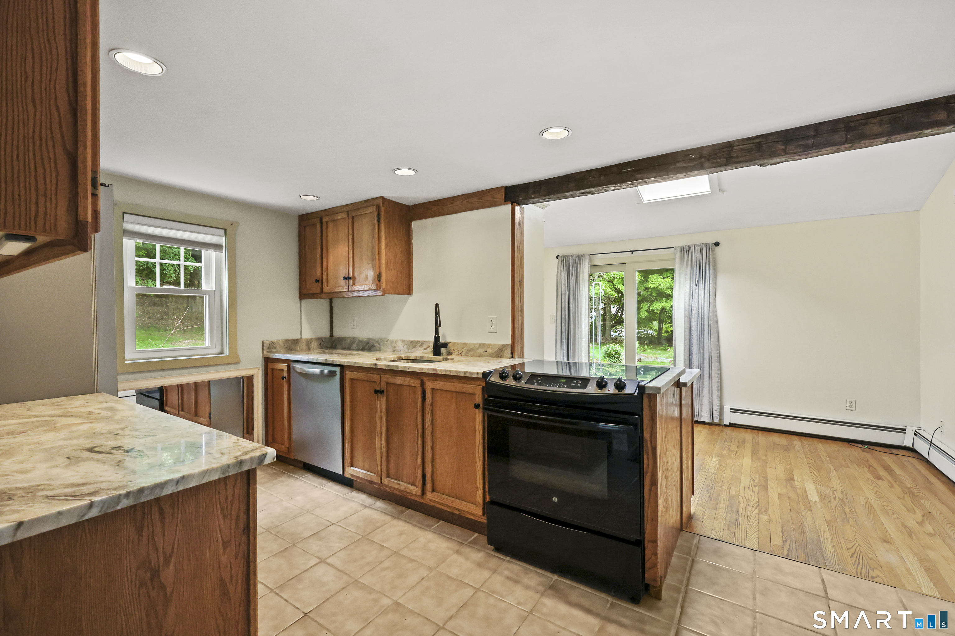 917 Hopewell Road Glastonbury, CT 06033 - Photo 7 of 39 a kitchen with granite countertop cabinets and window
