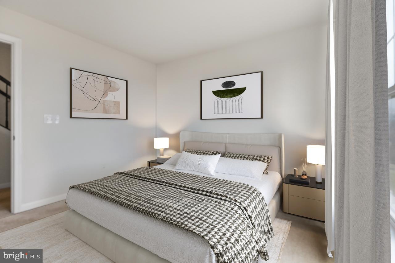 43367 Town Gate Square Chantilly, VA 20152 - Photo 22 of 36 a bedroom with a bed and a painting on the wall