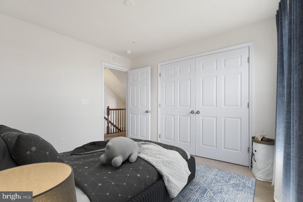 43367 Town Gate Square Chantilly, VA 20152 - Photo 27 of 36 a bedroom with a bed and furniture