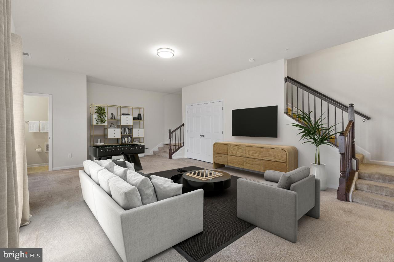 43367 Town Gate Square Chantilly, VA 20152 - Photo 30 of 36 a living room with furniture and a flat screen tv