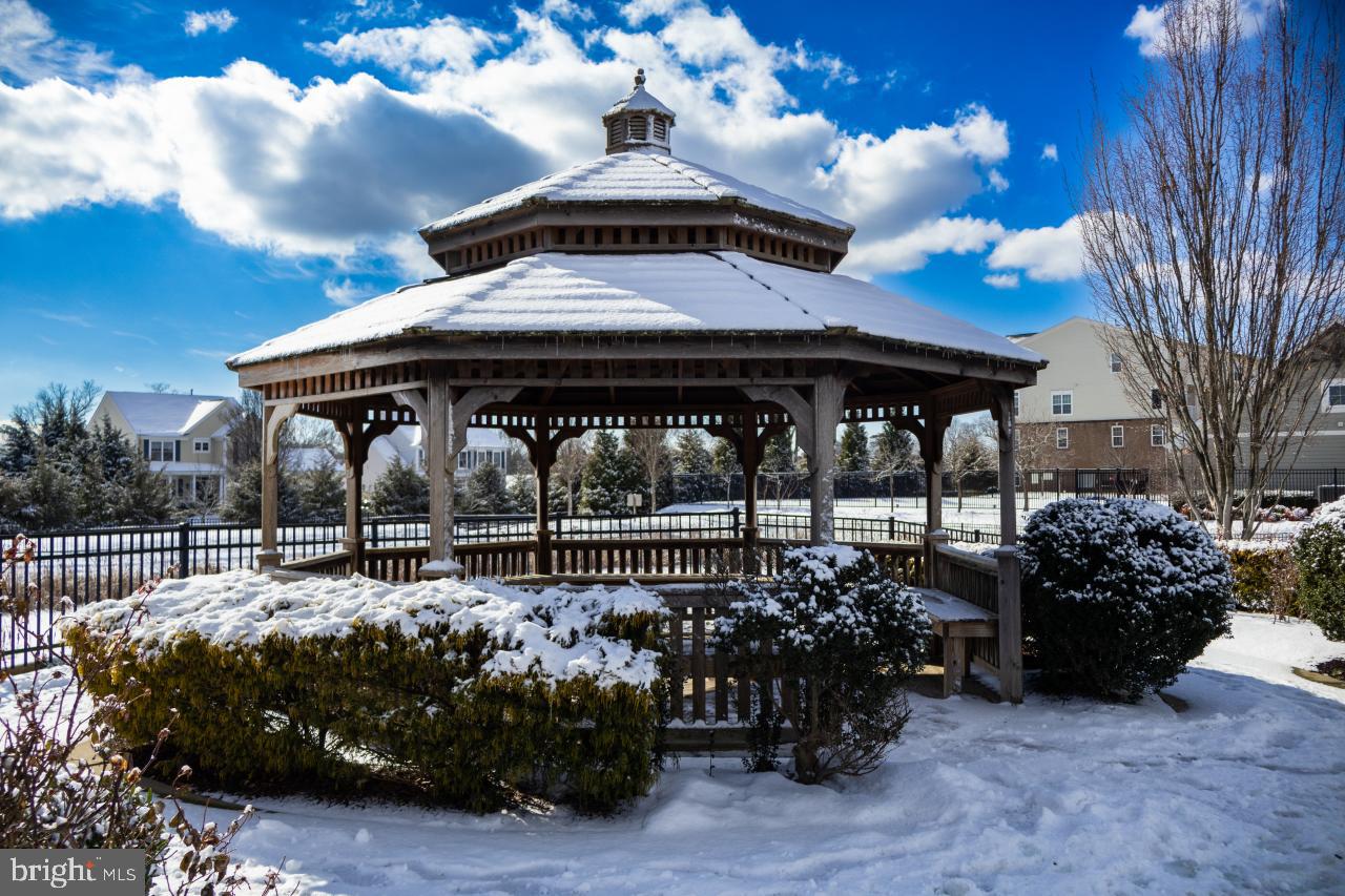 43367 Town Gate Square Chantilly, VA 20152 - Photo 34 of 36 a view of a chairs and tables in the back yard of the house