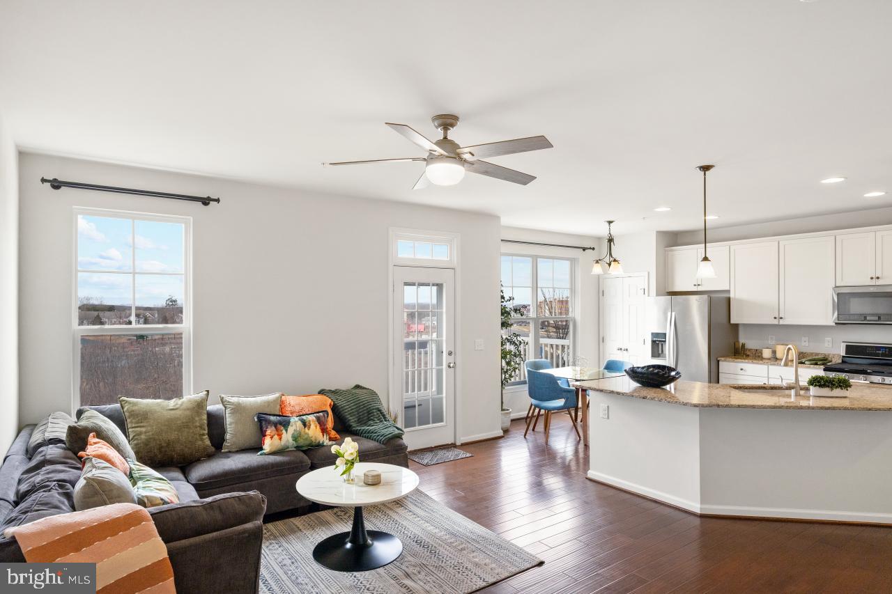 43367 Town Gate Square Chantilly, VA 20152 - Photo 4 of 36 a living room with furniture kitchen view and a large window