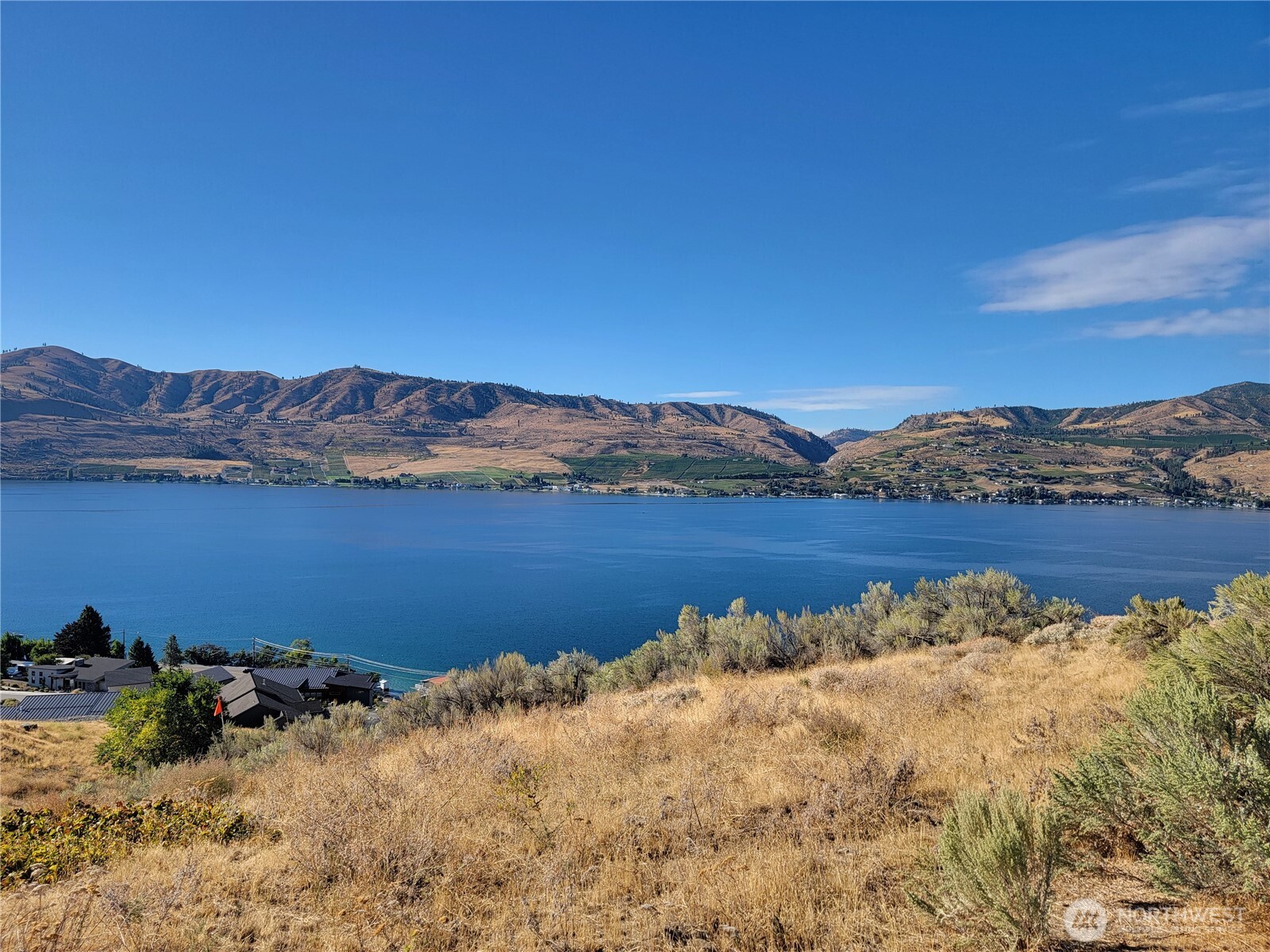 211 Viewland Way Chelan, WA 98816 - Photo 7 of 9 a view of a lake with mountains in the background