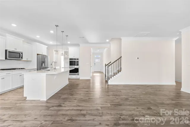 a view of kitchen with wooden floor