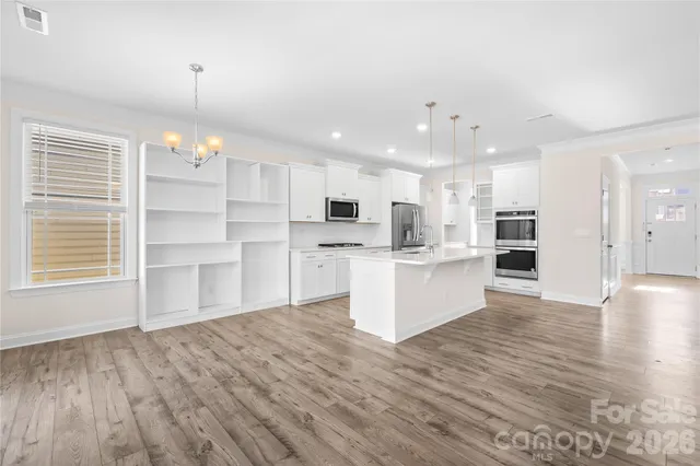 a view of kitchen with wooden floor and window