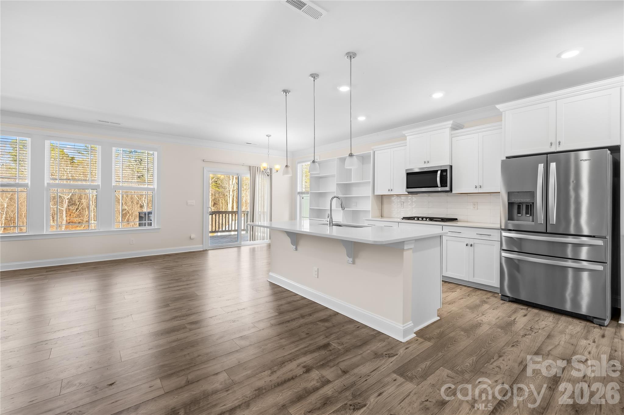 402 Preston Road Mooresville, NC 28117 - Photo 13 of 42 a kitchen with stainless steel appliances a refrigerator sink and microwave