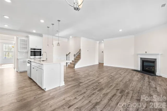 a view of a walk in closet and kitchen