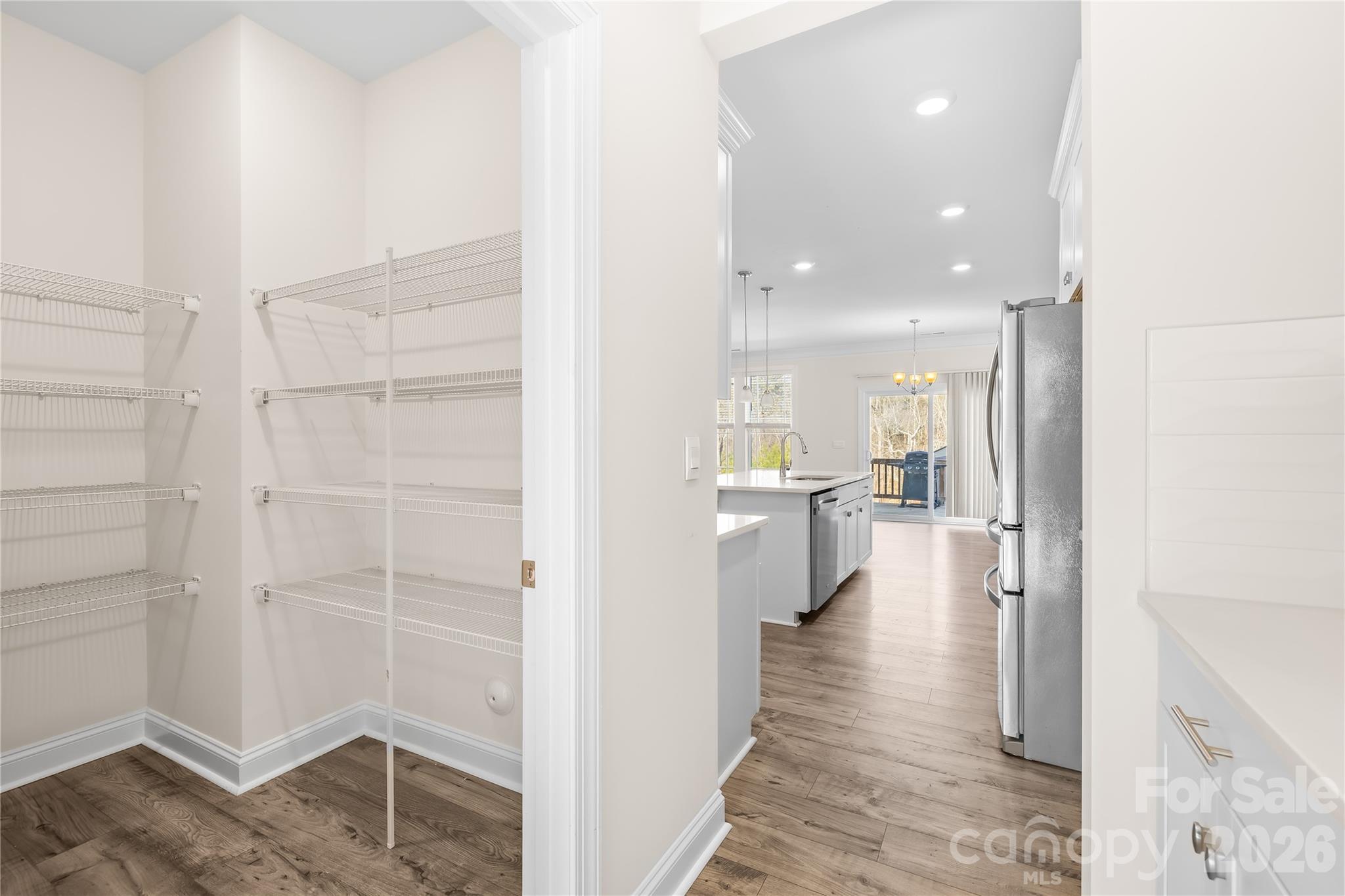 402 Preston Road Mooresville, NC 28117 - Photo 17 of 42 a view of a walk in closet and kitchen