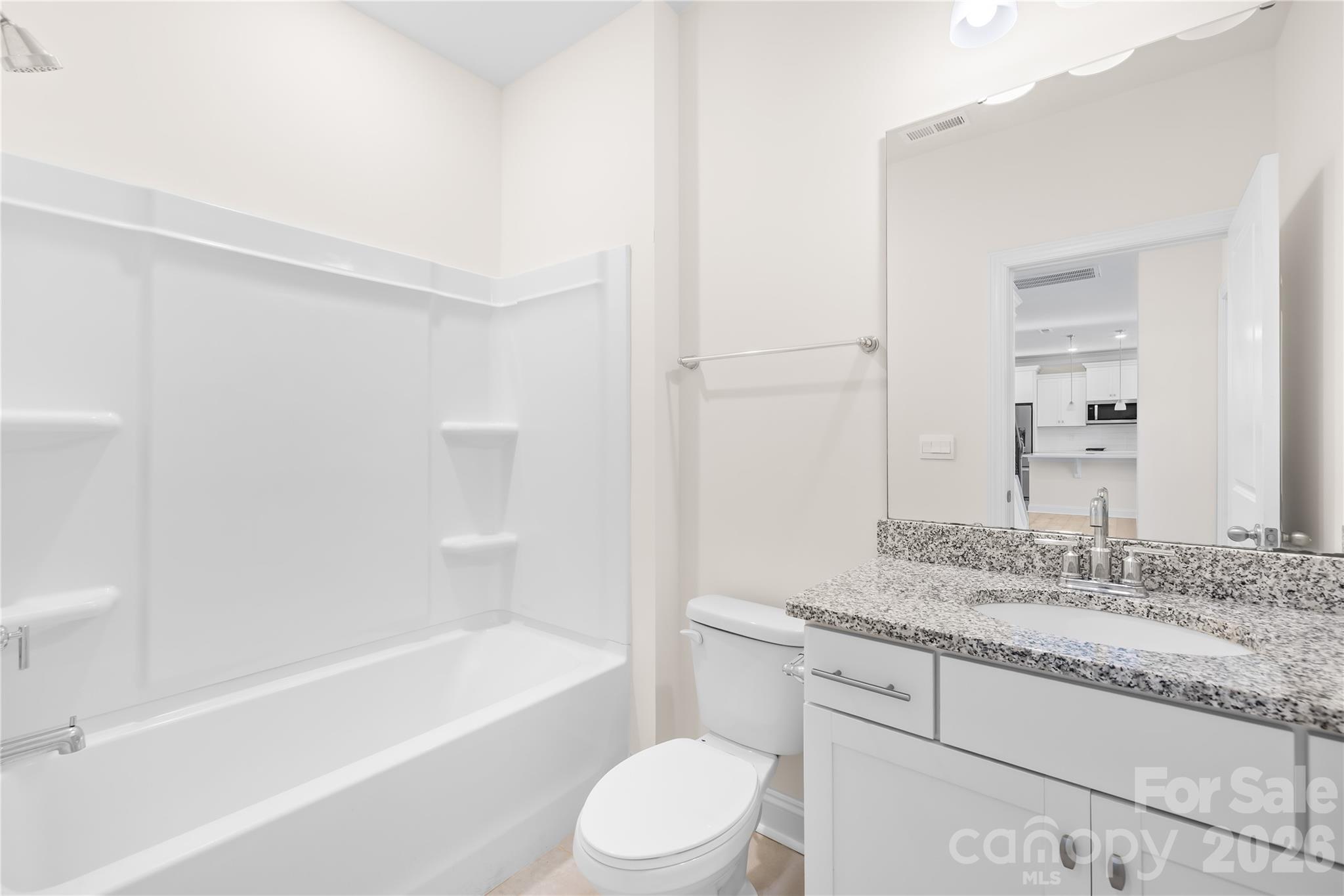 402 Preston Road Mooresville, NC 28117 - Photo 20 of 42 a bathroom with a granite countertop sink a toilet and bathtub