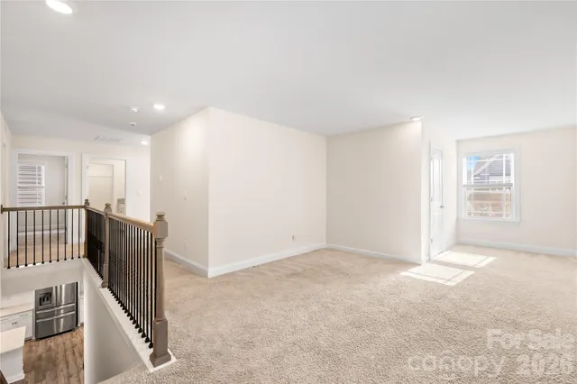 a bedroom with a large bed and a couch