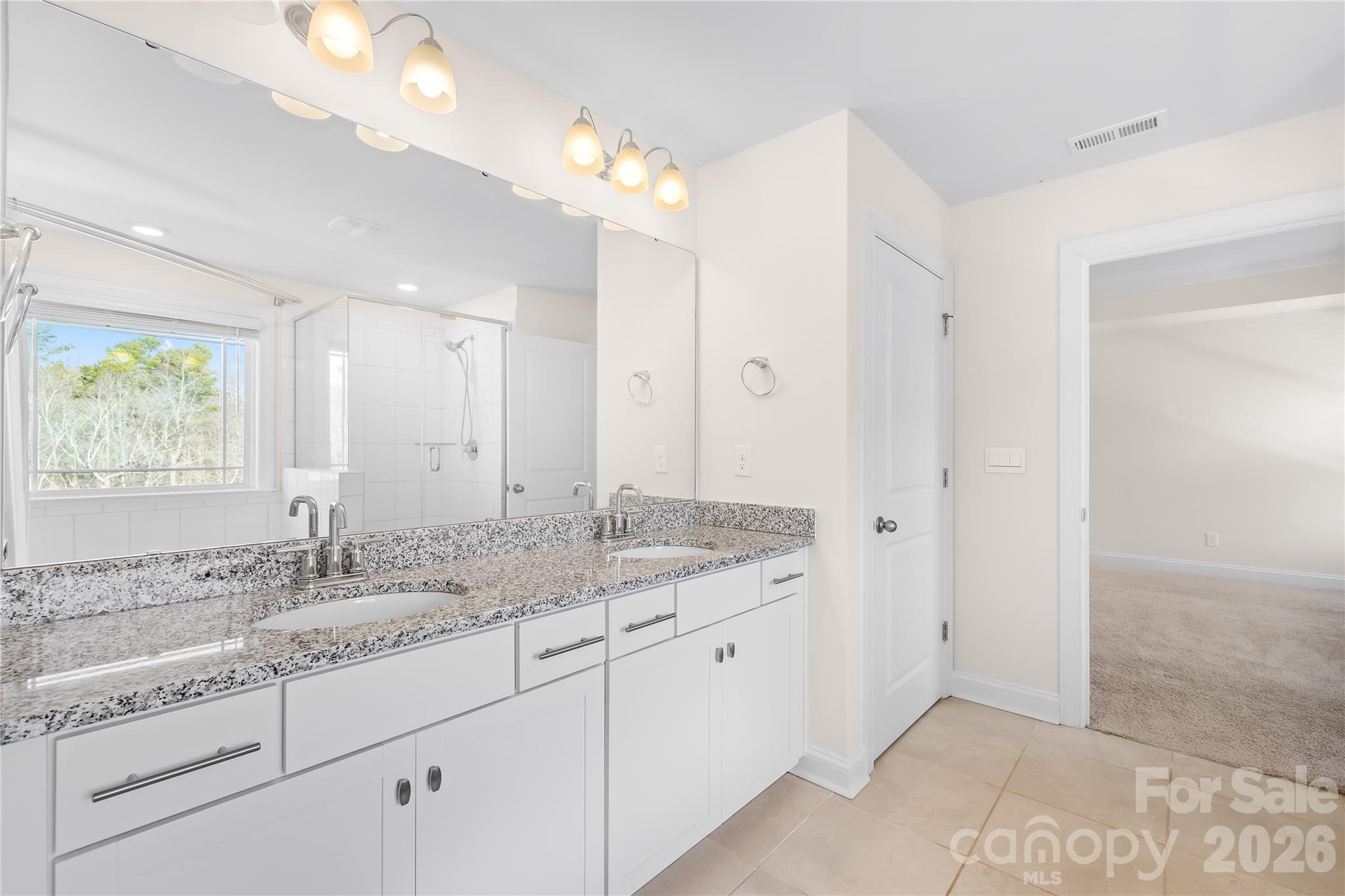 402 Preston Road Mooresville, NC 28117 - Photo 27 of 42 a bathroom with a granite countertop sink mirror and double