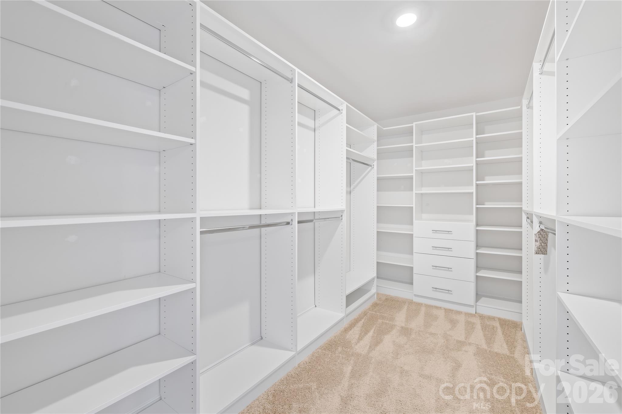 402 Preston Road Mooresville, NC 28117 - Photo 28 of 42 a view of walk in closet with empty racks