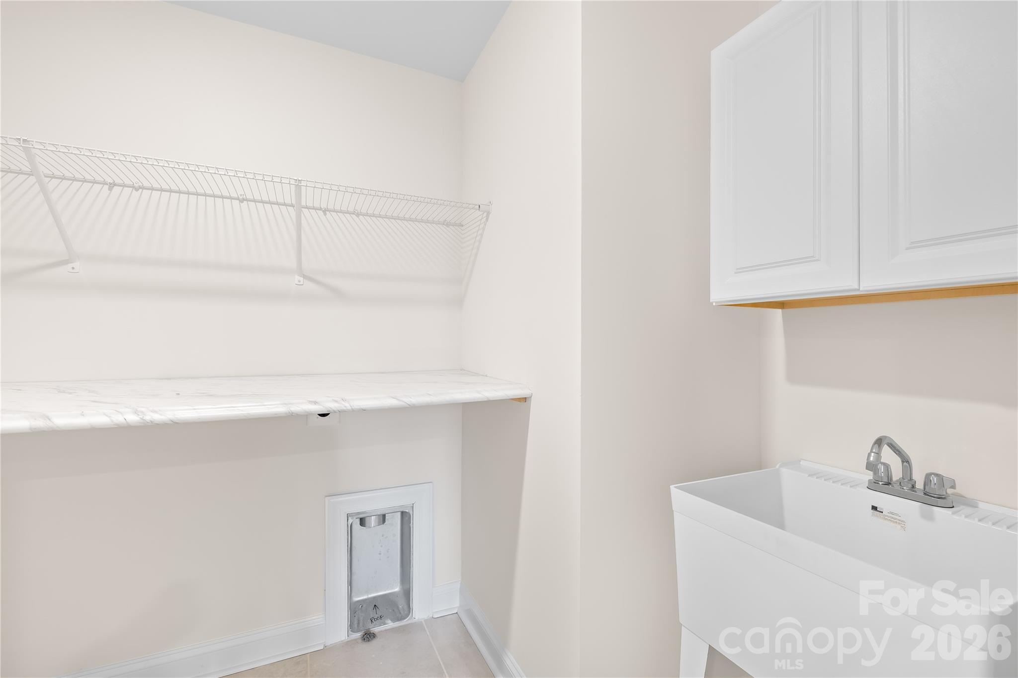 402 Preston Road Mooresville, NC 28117 - Photo 29 of 42 a bathroom with a sink and a bathtub