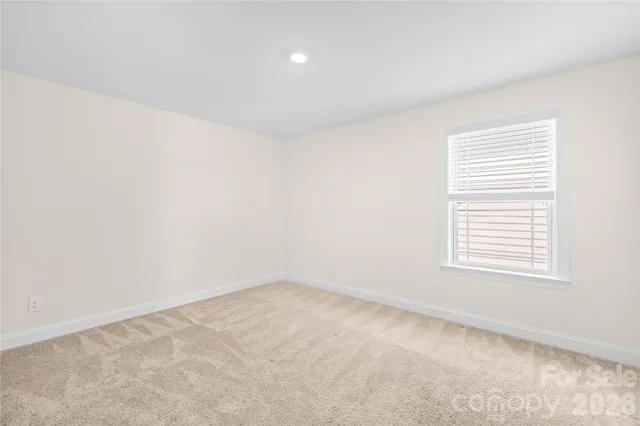 a bathroom with a granite countertop sink and a mirror with bathtub