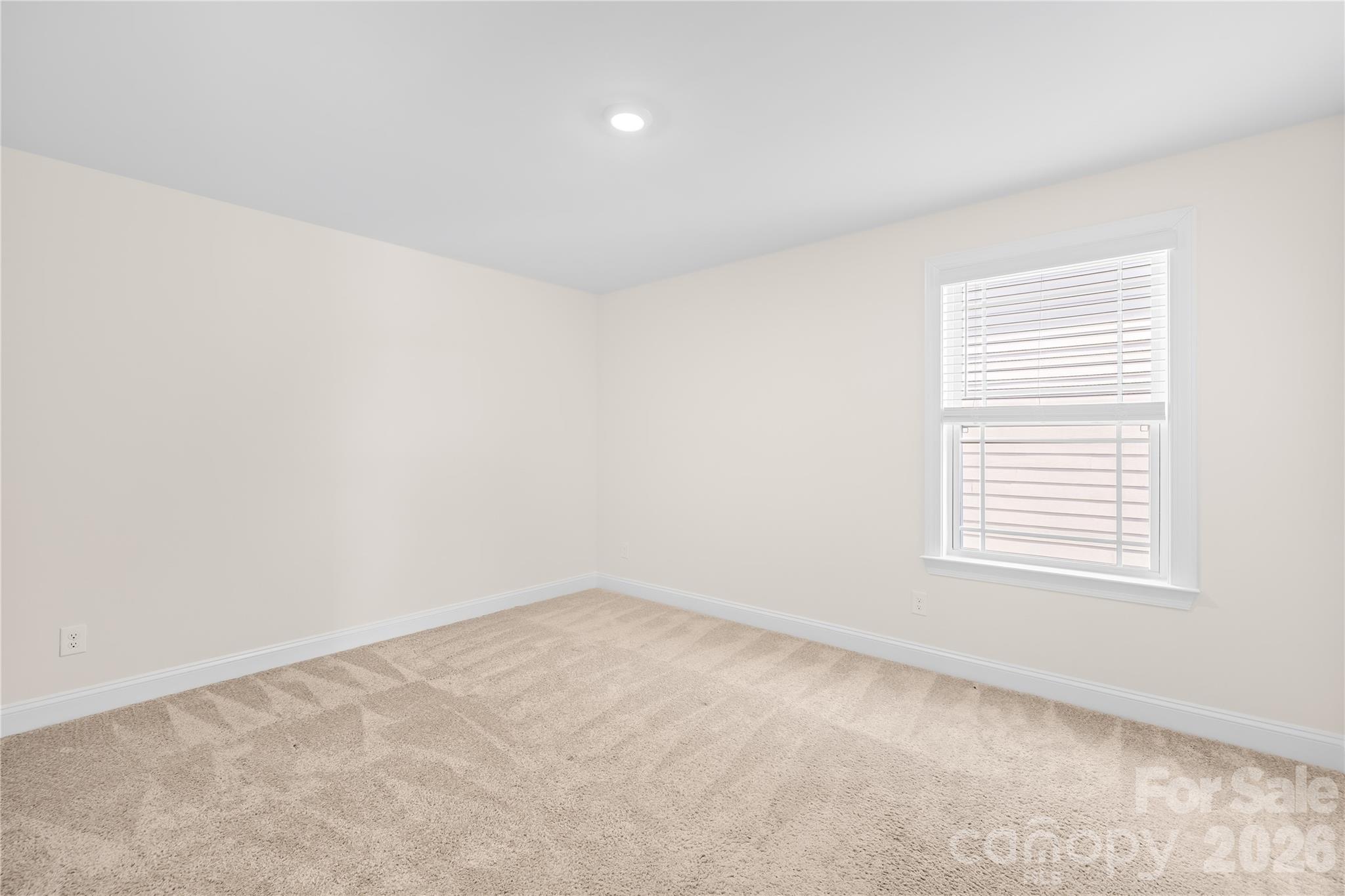 402 Preston Road Mooresville, NC 28117 - Photo 30 of 42 an empty room with a window