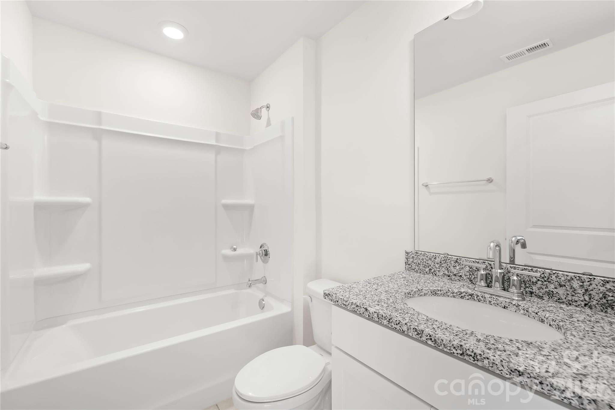 402 Preston Road Mooresville, NC 28117 - Photo 34 of 42 a bathroom with a granite countertop sink toilet and shower