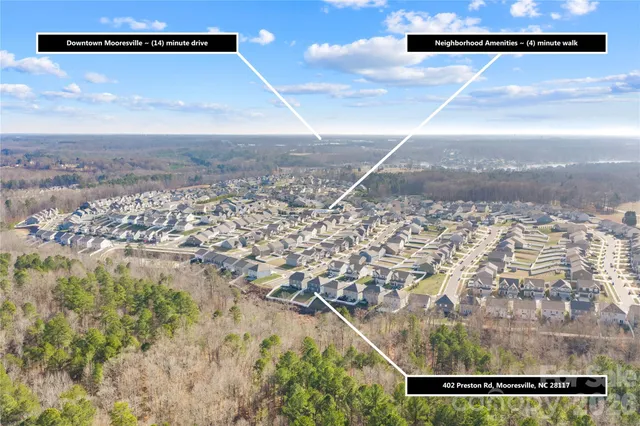 a view of a swimming pool with a garden and plants