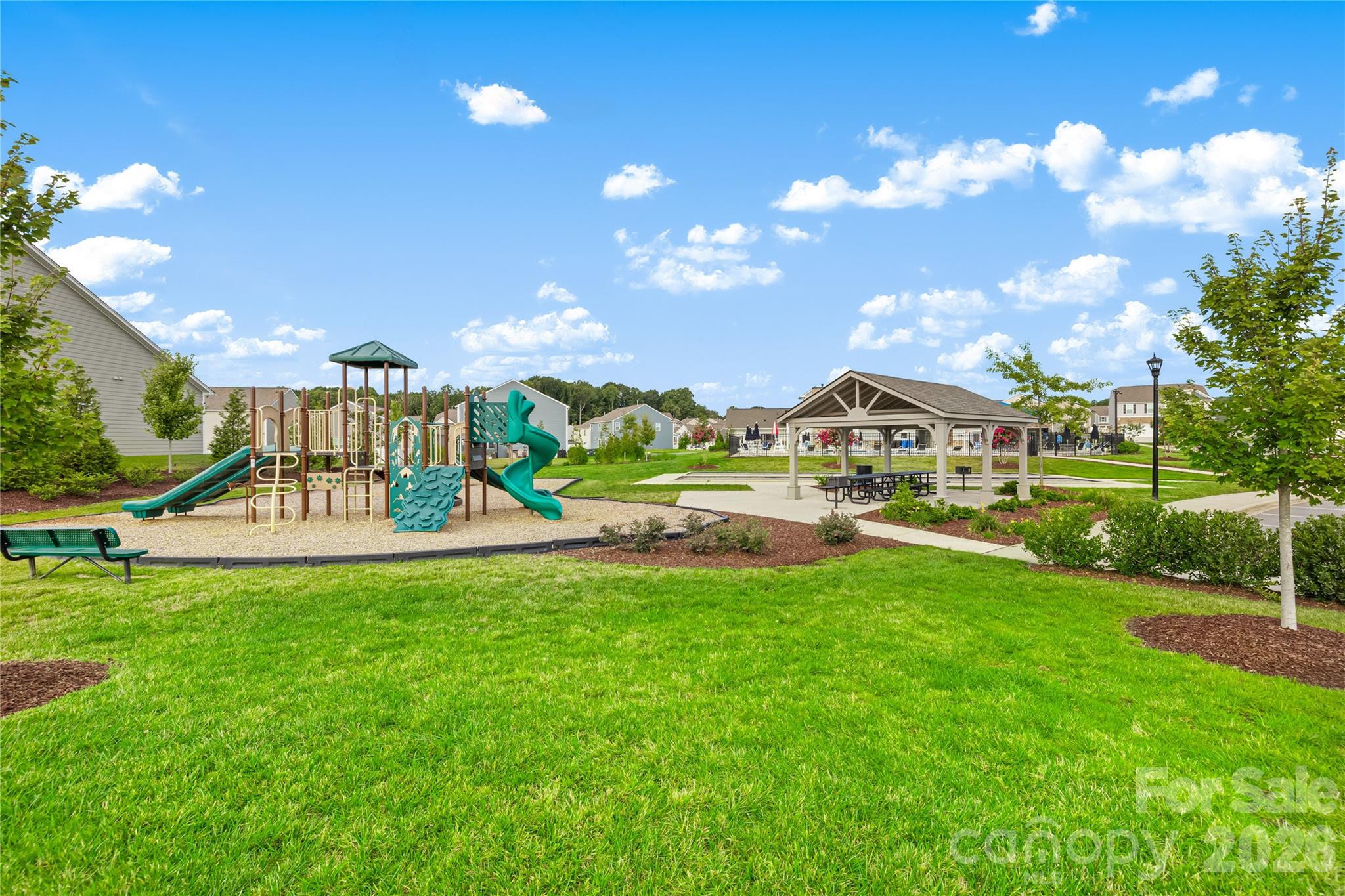 402 Preston Road Mooresville, NC 28117 - Photo 39 of 42 a view of a swimming pool with a garden and plants