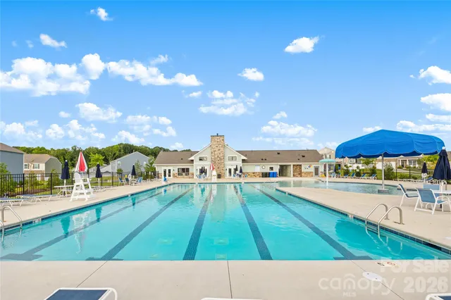 a view of a swimming pool with a table and chairs