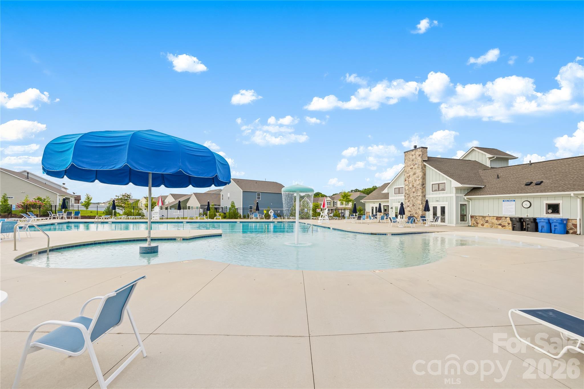 402 Preston Road Mooresville, NC 28117 - Photo 42 of 42 a view of a swimming pool with a table and chairs
