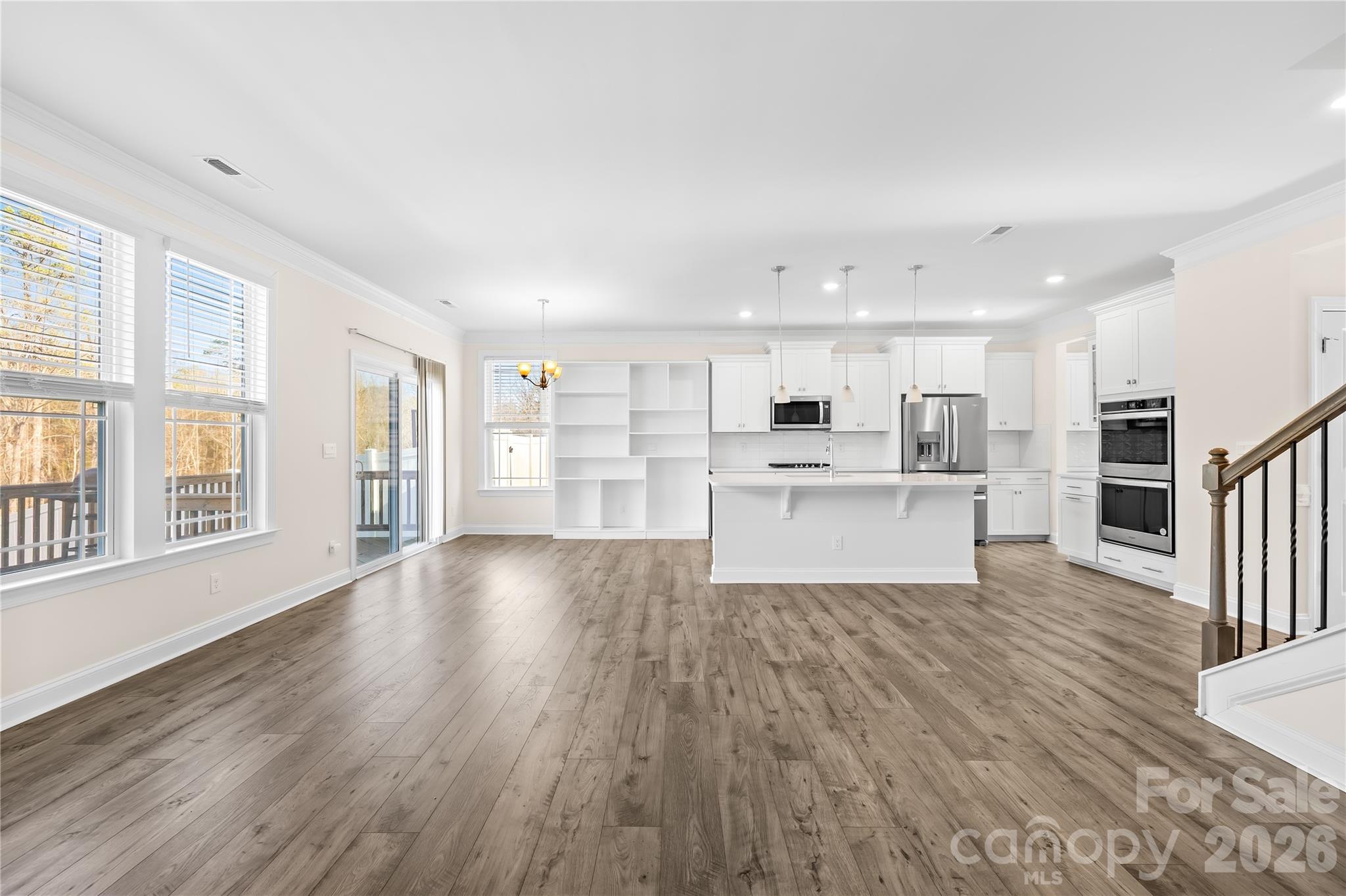 402 Preston Road Mooresville, NC 28117 - Photo 10 of 42 a view of kitchen with wooden floor and windows