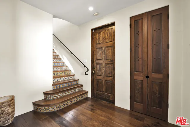 a view of entryway with wooden floor
