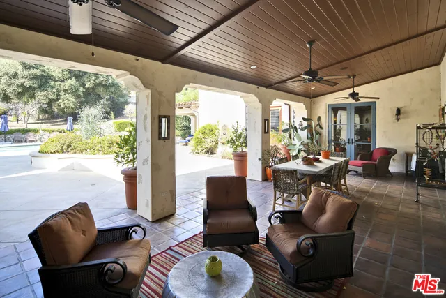 a outdoor living space with furniture and a large window