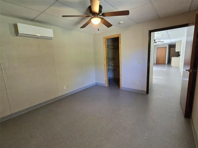 a view of empty room with ceiling fan
