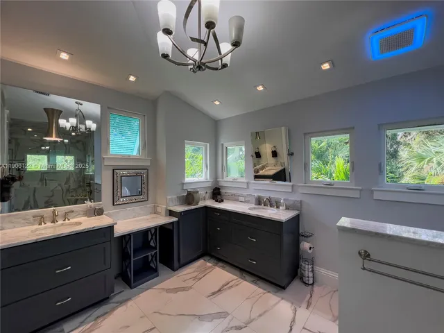 a bathroom with a toilet a sink and shower