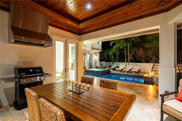 a view of a backyard with sitting area