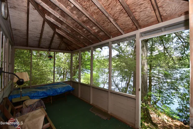 a view of a chairs and table in a patio