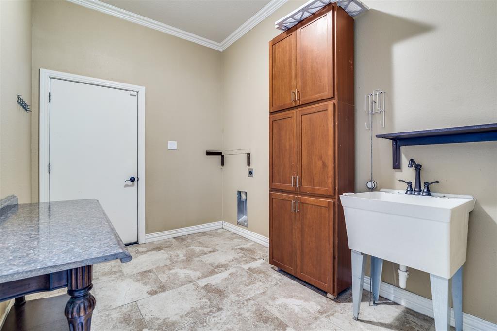 511 East Cook Street, Unit 1 Josephine, TX 75173 - Photo 14 of 29 a kitchen with a refrigerator and cabinets