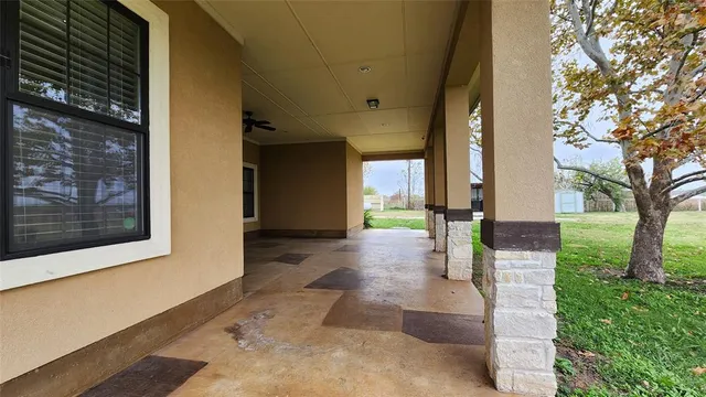 a view of outdoor space with green field and trees