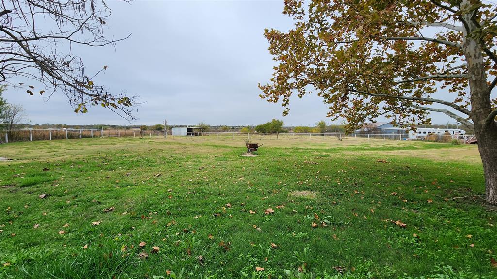 511 East Cook Street, Unit 1 Josephine, TX 75173 - Photo 17 of 36 a view of outdoor space with green field and trees