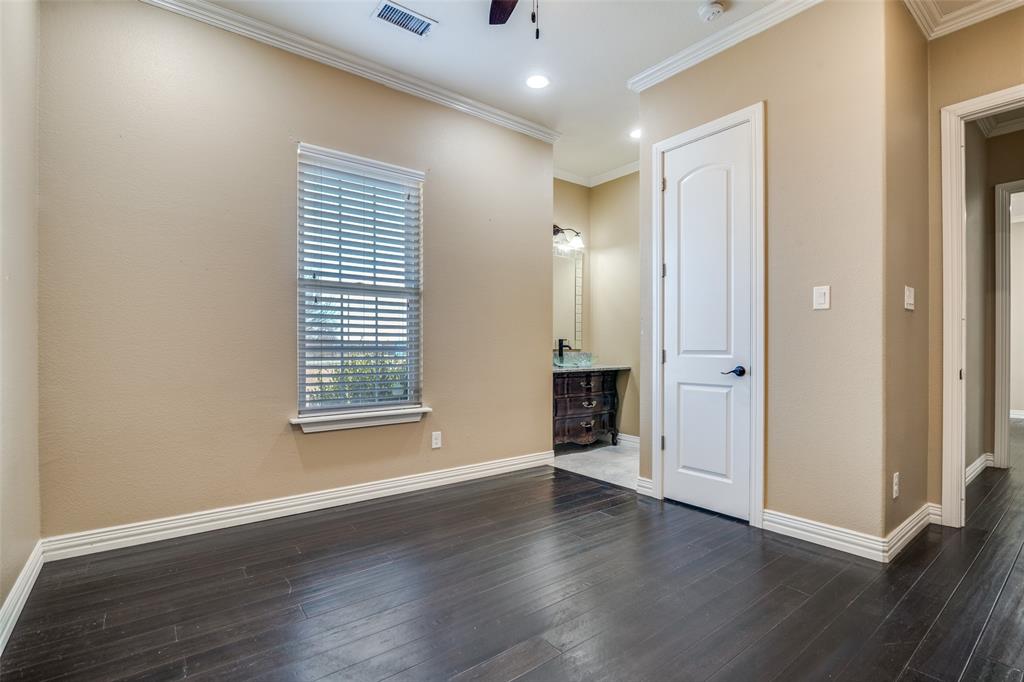 511 East Cook Street, Unit 1 Josephine, TX 75173 - Photo 18 of 29 an empty room with wooden floor and windows