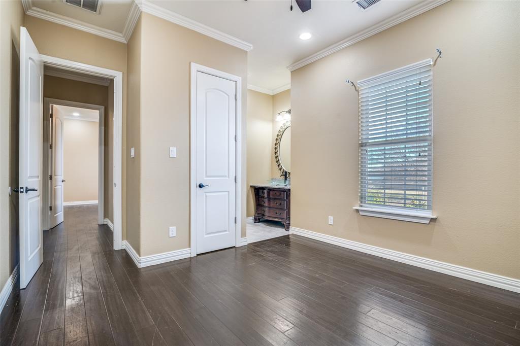 511 East Cook Street, Unit 1 Josephine, TX 75173 - Photo 19 of 29 an empty room with wooden floor and a window
