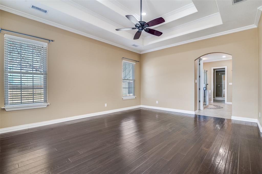511 East Cook Street, Unit 1 Josephine, TX 75173 - Photo 21 of 29 a view of an empty room with wooden floor and a window