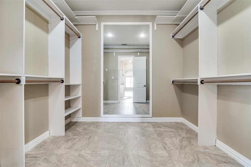 511 East Cook Street, Unit 1 Josephine, TX 75173 - Photo 22 of 29 a view of walk in closet with empty racks
