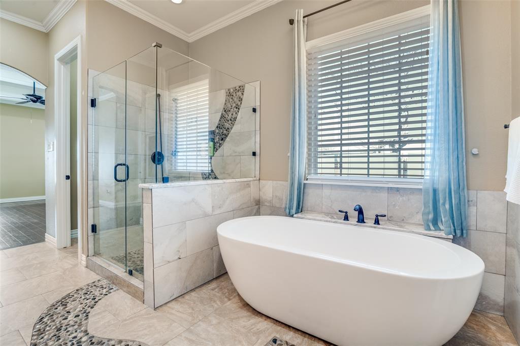 511 East Cook Street, Unit 1 Josephine, TX 75173 - Photo 24 of 29 a white bath tub sitting in a bathroom next to a window