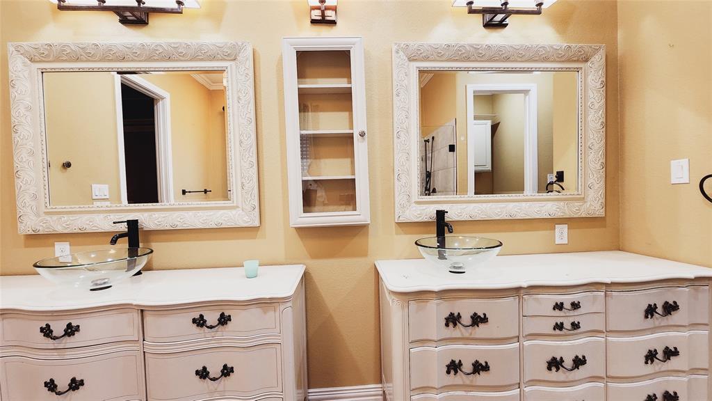 511 East Cook Street, Unit 1 Josephine, TX 75173 - Photo 24 of 36 a bathroom with a sink and a mirror