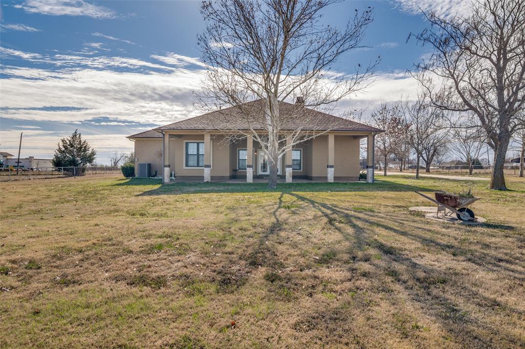 511 East Cook Street, Unit 1 Josephine, TX 75173 - Photo 26 of 29 a view of a house with a big yard and large trees