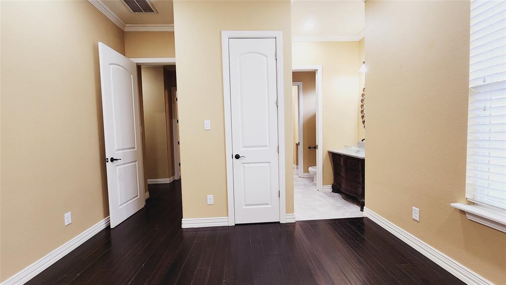 511 East Cook Street, Unit 1 Josephine, TX 75173 - Photo 28 of 36 an empty room with wooden floor and windows