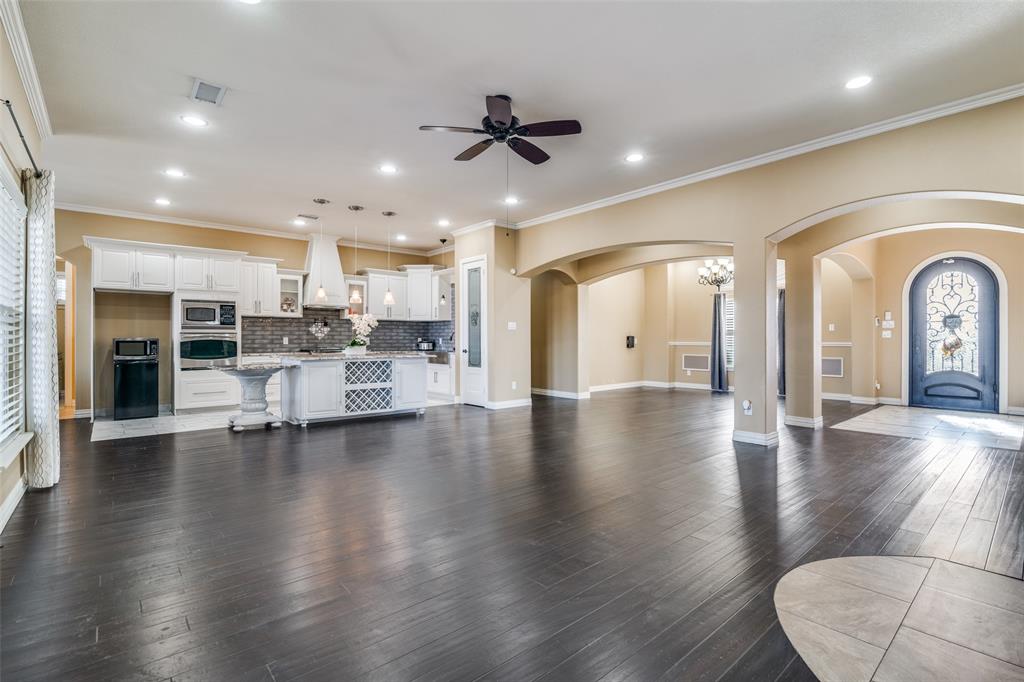 511 East Cook Street, Unit 1 Josephine, TX 75173 - Photo 5 of 29 a view of dining room with furniture and wooden floor