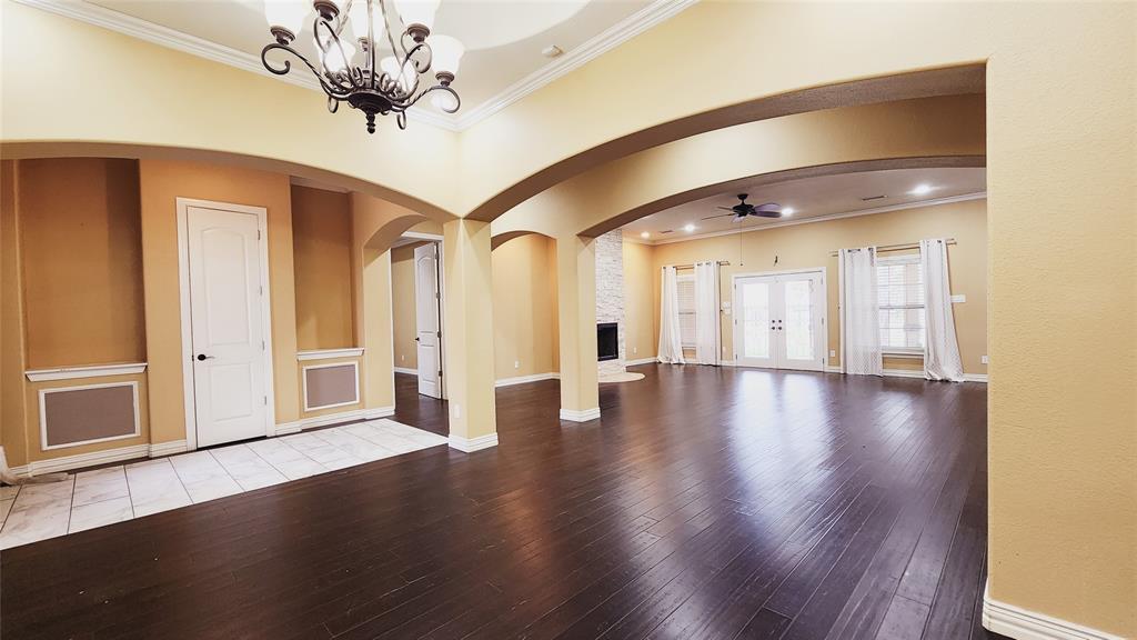 511 East Cook Street, Unit 1 Josephine, TX 75173 - Photo 6 of 36 a view of a livingroom with wooden floor and a ceiling fan